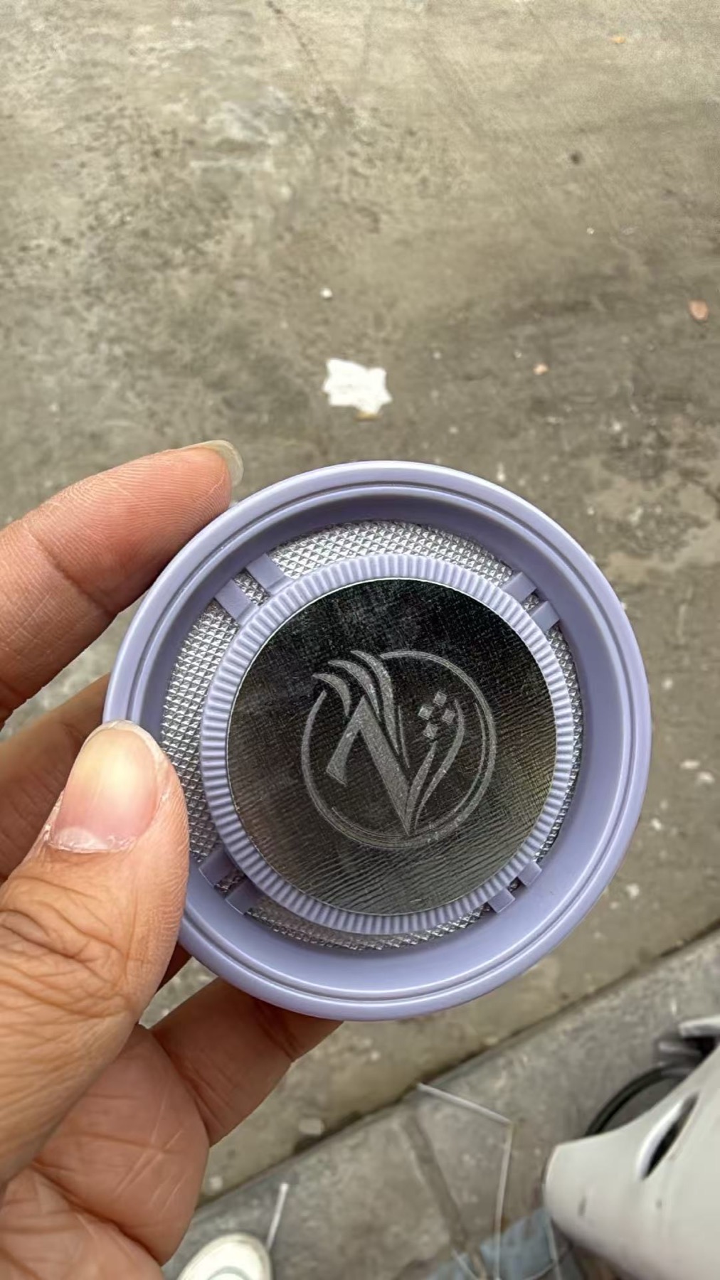 Top view of Zelkyn solid car fragrance with foil seal and logo detail